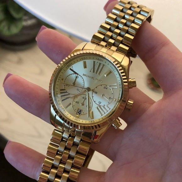 Michael Kors Lexington Chronograph Champagne Dial Ladies Watch MK5556 Water resistance: 100 meters / 330 feet Movement: Quartz