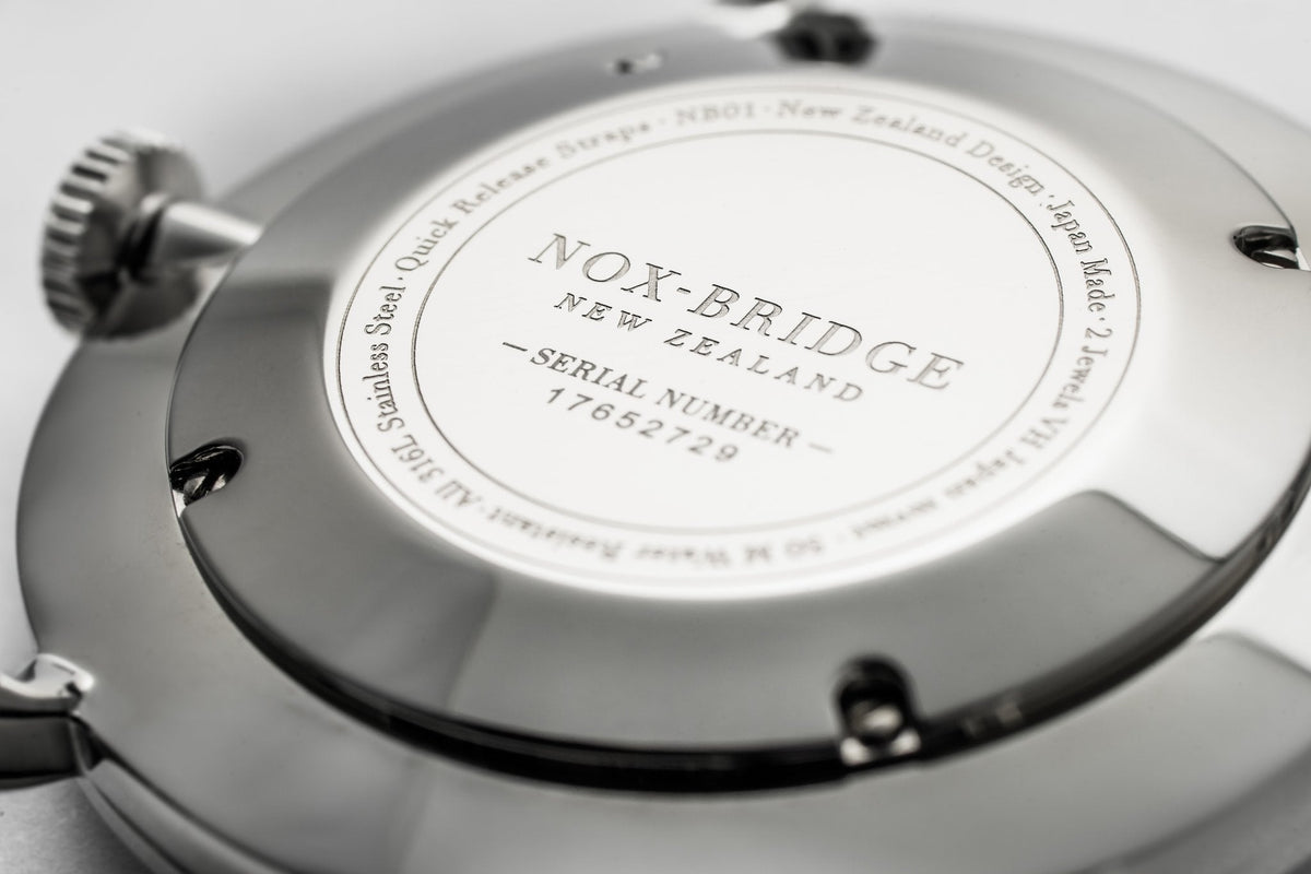 Caseback engraving showing Nox-Bridge New Zealand branding and serial number