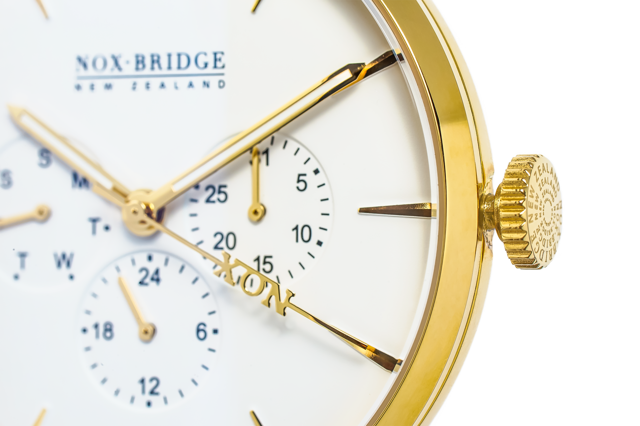 Close-up of Meissa gold watch dial showing chronograph sub-dials and gold plated bezel
