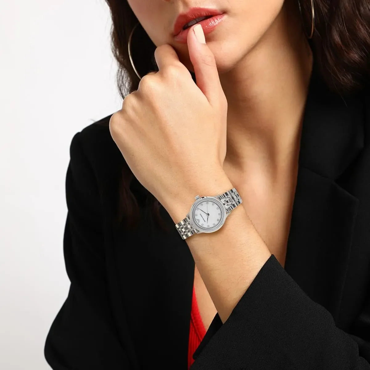 Emporio Armani Alpha X-Small silver watch on woman's wrist with mother-of-pearl dial