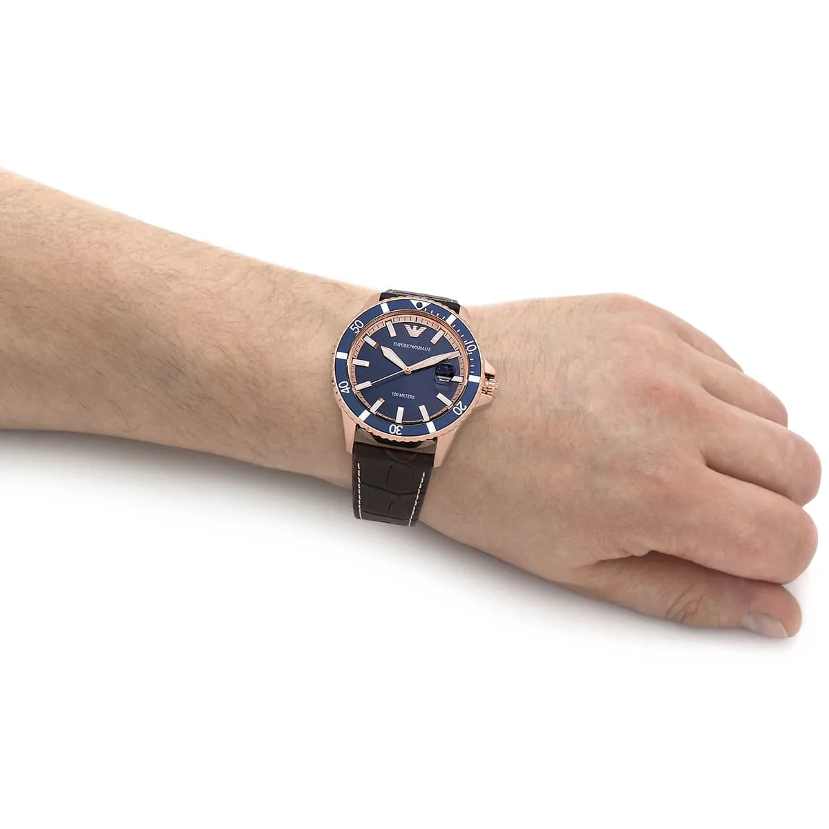 Emporio Armani AR11556 on wrist showing rose gold case with blue dial and brown strap