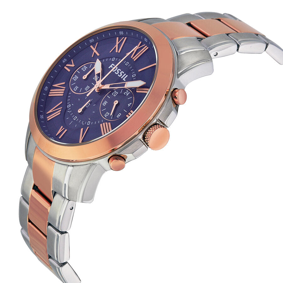 Side angle view of Fossil Grant chronograph showing two-tone metal bracelet and rose gold bezel with blue dial