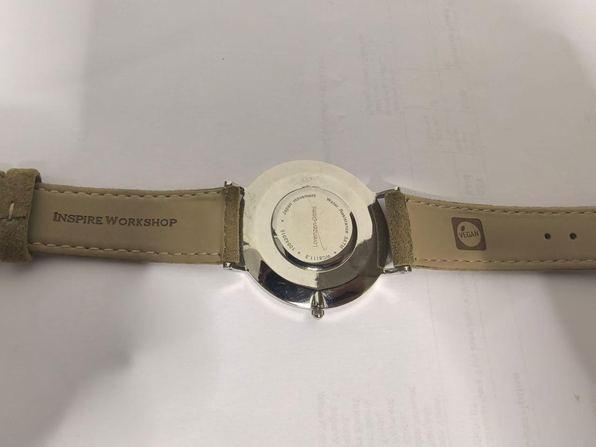 Lorenzen Dilimi watch caseback with engraved text and leather strap