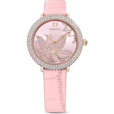 Swarovski crystal women's watch with pink dial, rose-gold butterfly motif, and crystal-set bezel