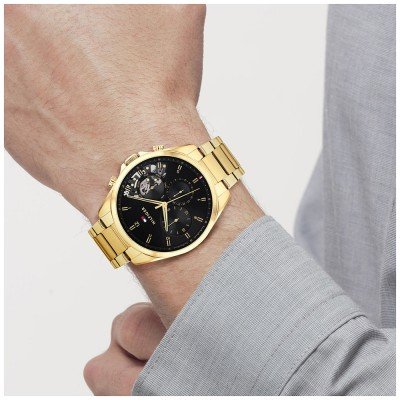 Tommy Hilfiger Baker gold chronograph watch worn on wrist